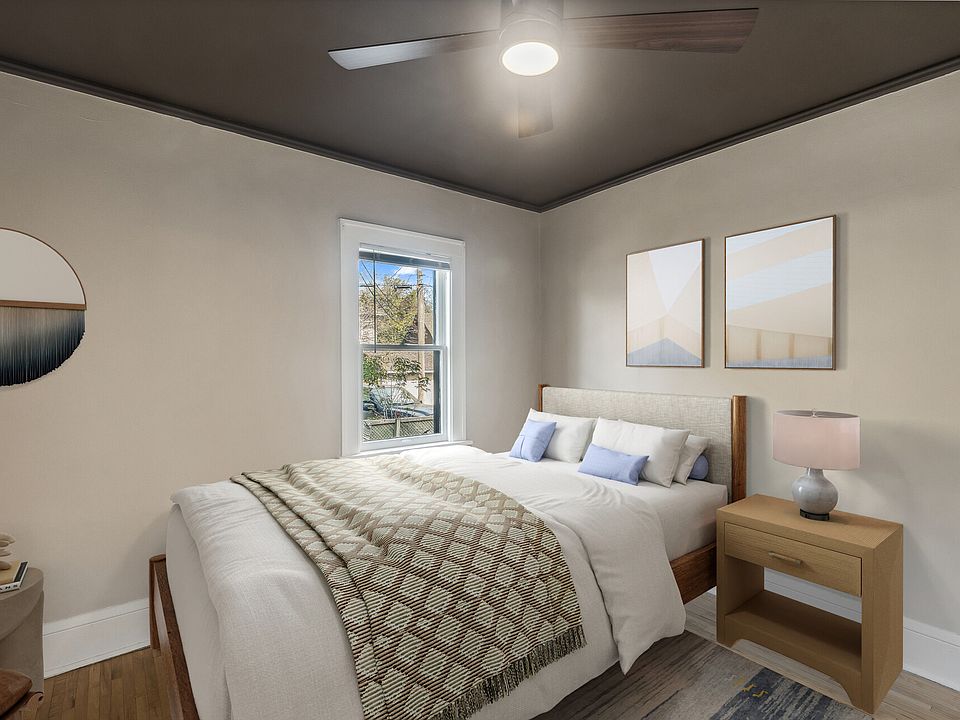 Primary bedroom! Ceiling fans and hardwood floors!
