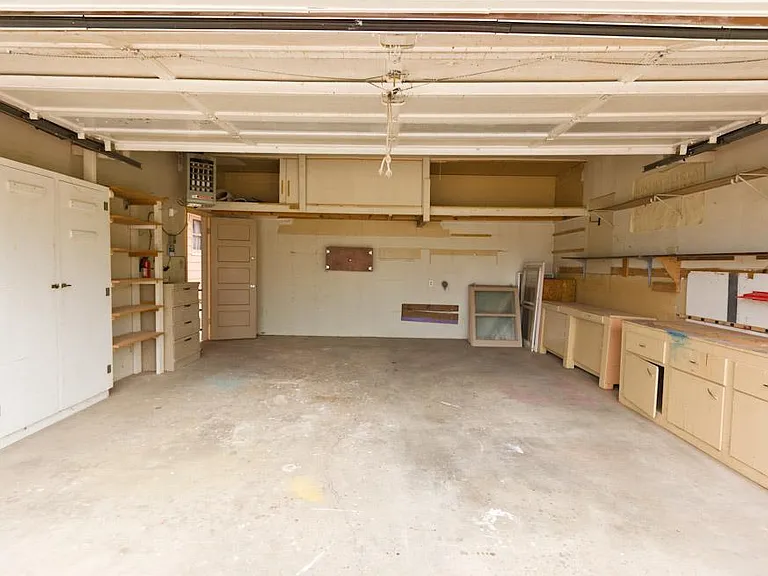 Two Car Garage with separate workshop not pictured. (Tenants currently in home. These are previous photos. Updated photos coming soon.)