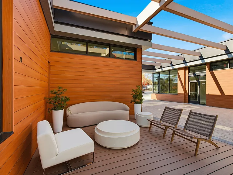 Unwind in the serene outdoor lounge at Eagle Rock Apartments at Woodbury, designed for relaxation with stylish seating and a tranquil atmosphere. Elevate your lifestyle today. Schedule a tour to see it for yourself!