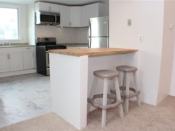 Enjoy your morning coffee here at the butcher block countertop!