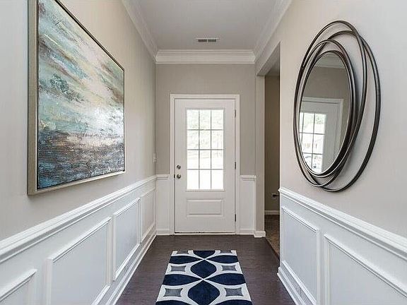 Extended entry foyer features hardwoods