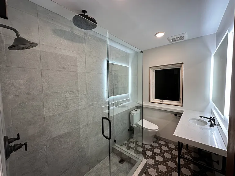 Primary bathroom with Toto Washlet and dual-head shower