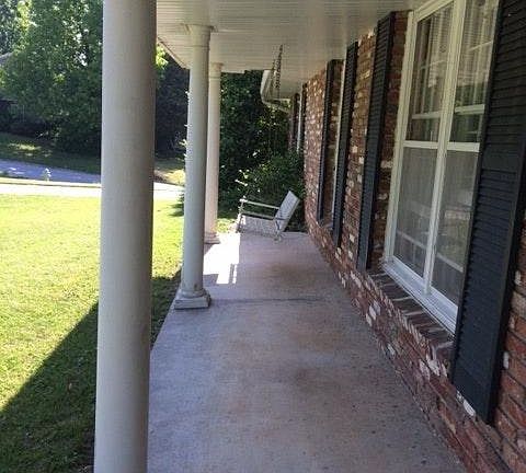 The front porch has a swing.