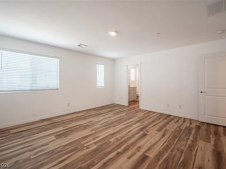Primary bedroom: "Spacious primary bedroom with walk-in closet.
