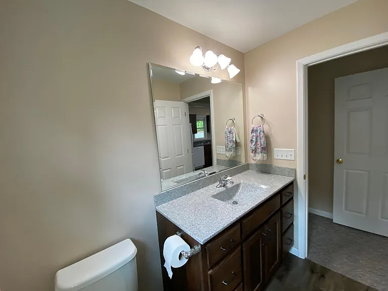 Master bath view to hallway and Master bedroom.