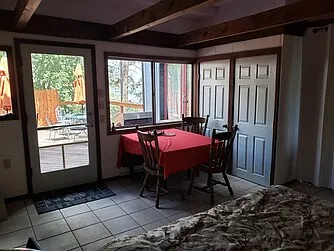 Smaller, indoor eating area in entry room, double door storage closet, one side shelved