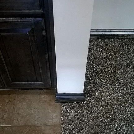 The kitchen, hallway and bathrooms have tile floors and bedr