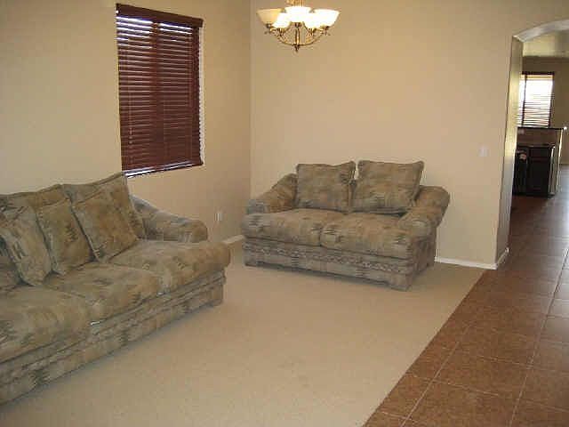 Formal living room entrance with upgraded carpet and 20x20 Italian tile