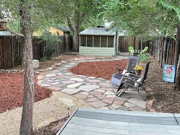 Rear fenced private yard with additional screened porch in rear
