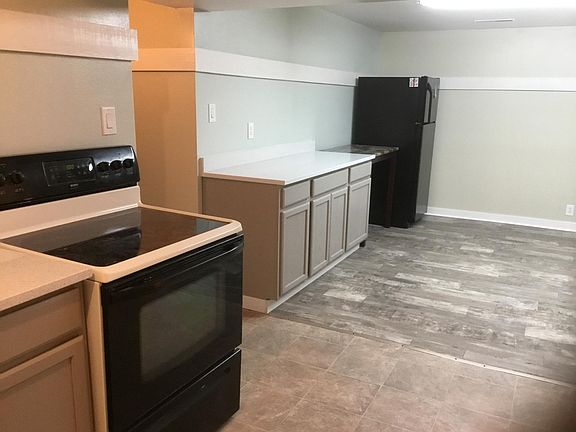 Kitchen with new cabinets and new quart countertop.