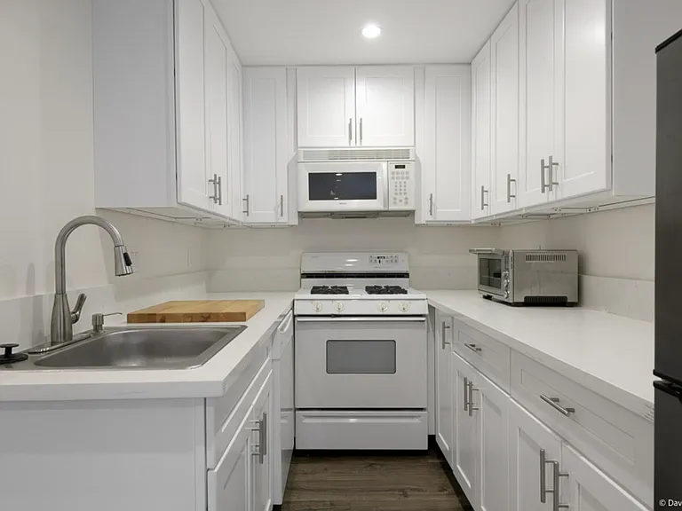 Full kitchen includes garbage disposal, dishwasher, gas oven and stove, microwave, toaster oven, Keurig coffee maker, refrigerator