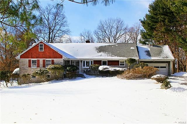 Sprawling ranch home set on private wooded lot.