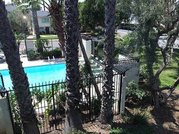 Overlooks pool and greenbelt.