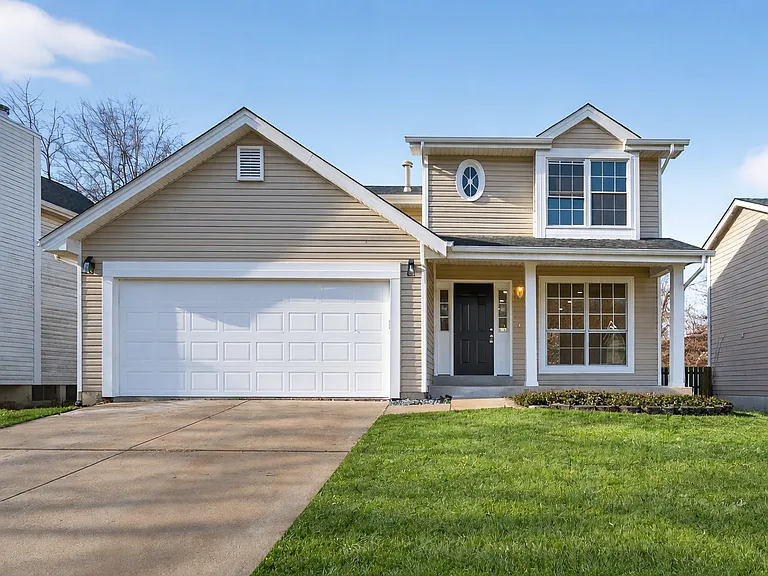 Front exterior with attached garage