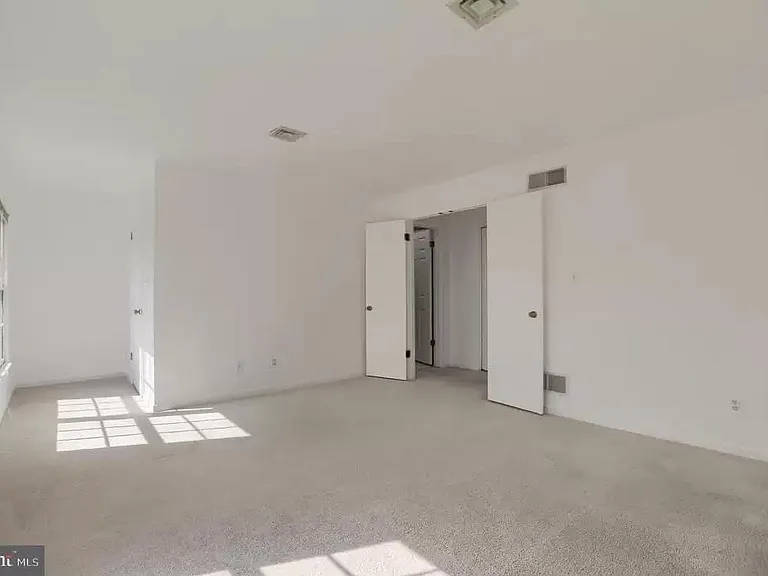 Second bedroom with a walk-in closet and bathroom