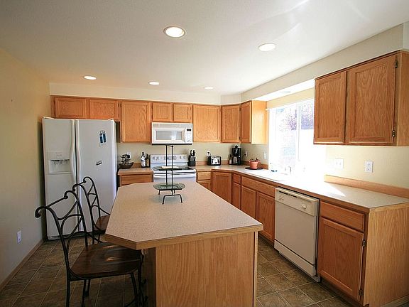 Island kitchen with slider to back yard