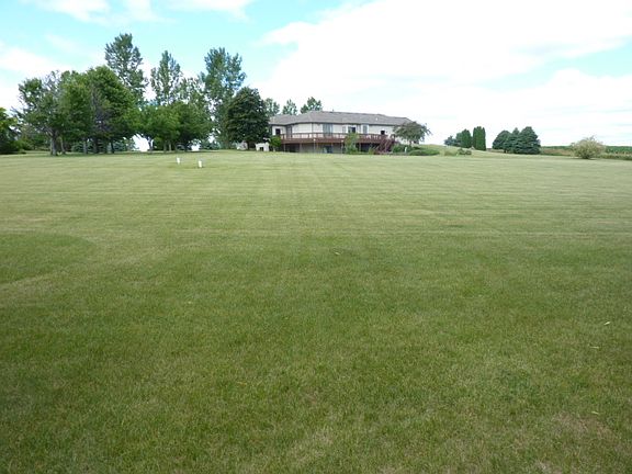 View of back yard to house.
