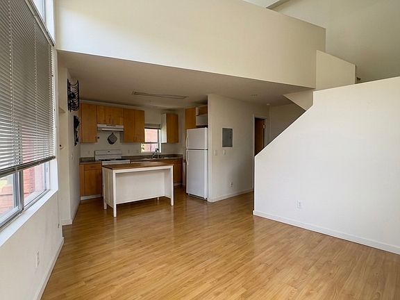 second floor with kitchen, living room and bathroom