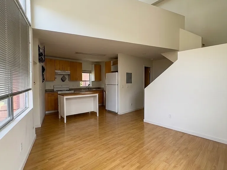 second floor with kitchen, living room and bathroom