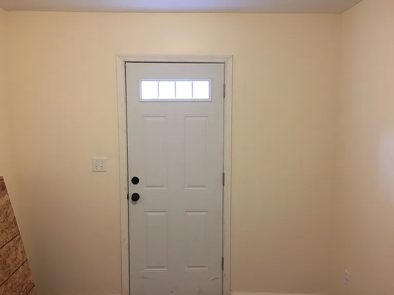 Bedroom 2 with exit to the backyard