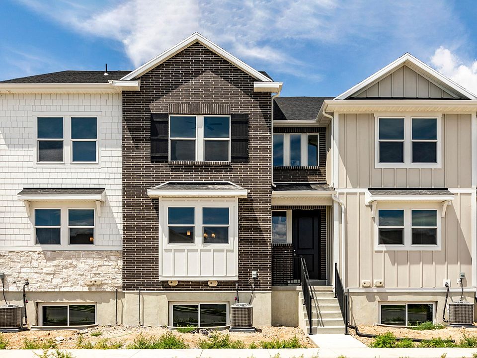 Middle Unit Townhome ( Black door and Brick Facade - white facades 
are neighboring townhomes)