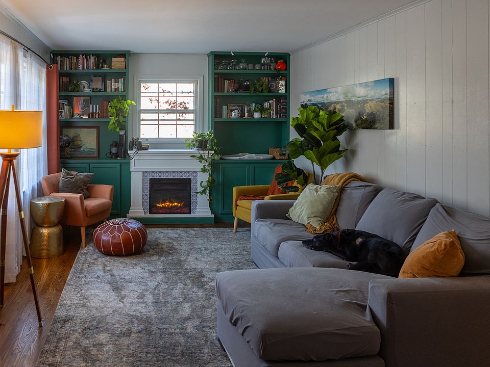 Cozy living room with built-in bookshelves and electric fireplace