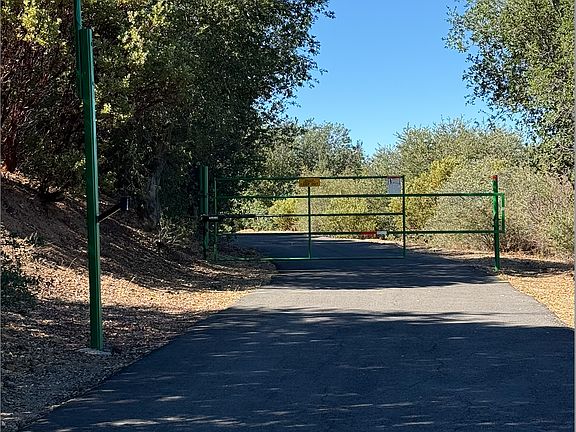 Private Gated Entrance:
Set along a private paved road behind an electronic gate for added privacy and security.