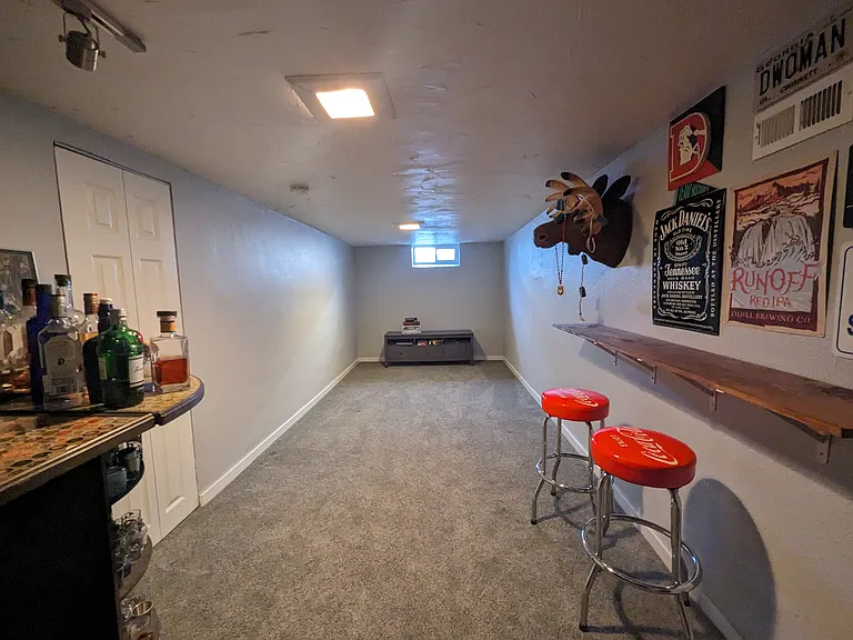 Basement family room for entertaining and keeping cool on hot summer days.