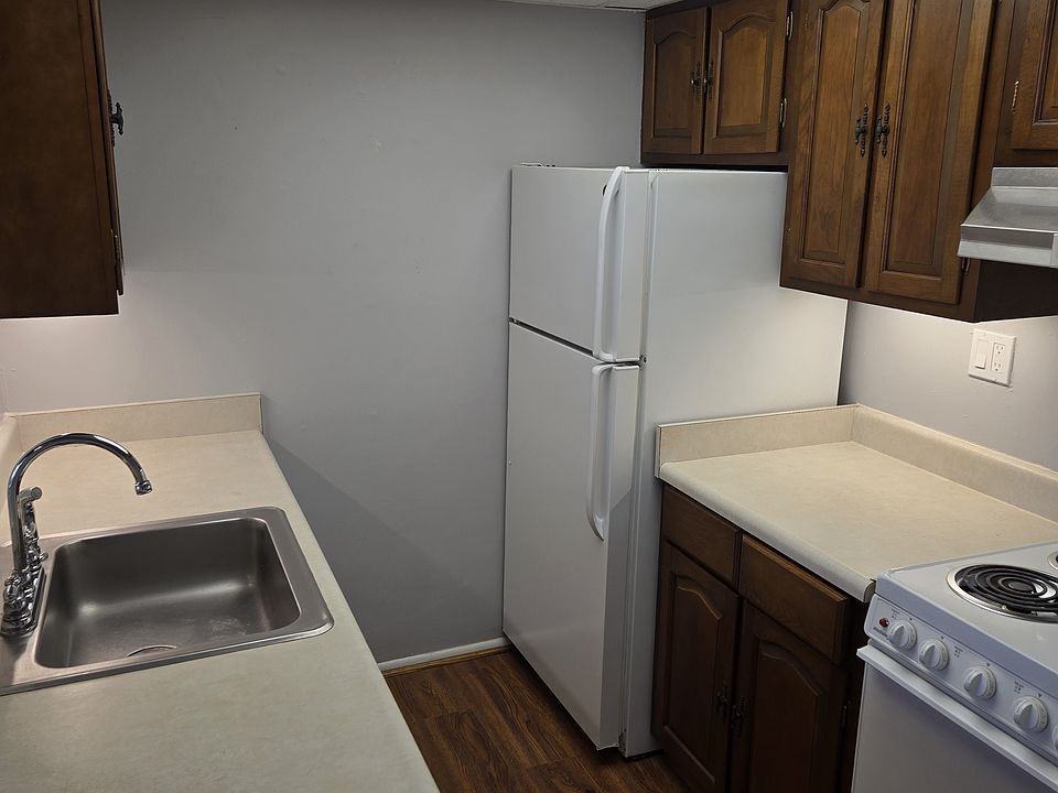 Kitchen has lots of light, including under cabinet lighting, dishwasher, stove, fridge w/icemaker, disposal, and plenty of cabinets!