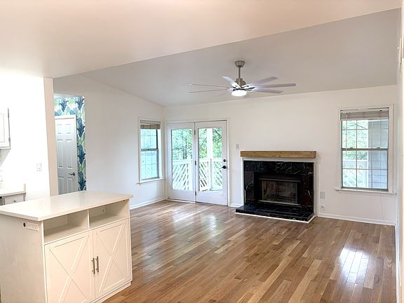 Living area with vaulted ceilings, new fan