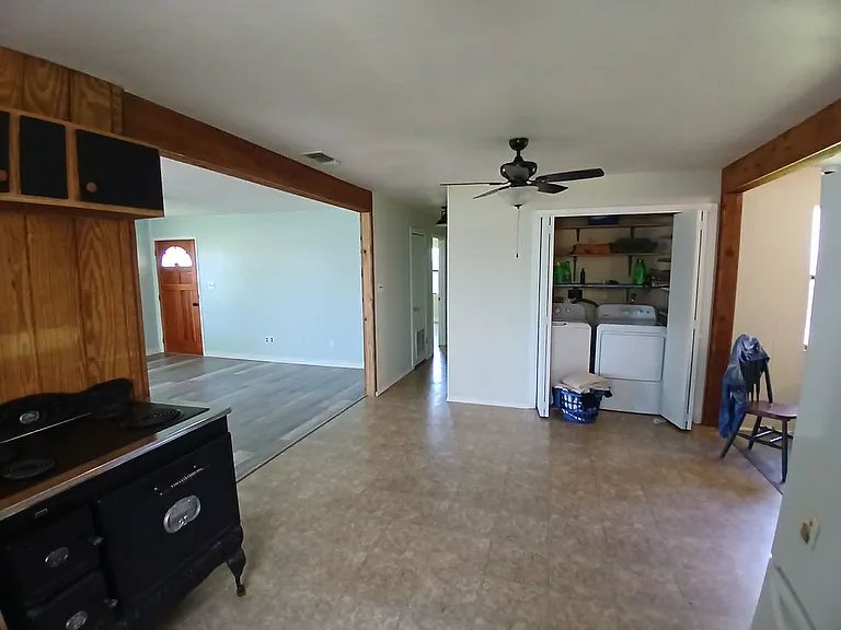 Kitchen with laundry room (no appliances provided)