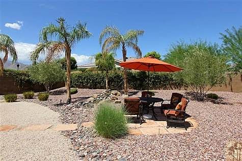 Covered patio area as well as open air patio space. The water feature adds to the pleasure & comfort of this setting.