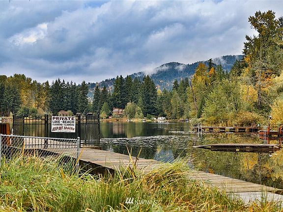 Enjoy beach rights to private Lake McDonald. Offering a private dog and clubhouse, just steps away. 