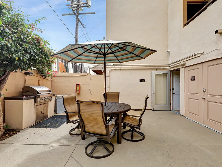 One of two Patio area, this one offers a gas grill with seating area.
