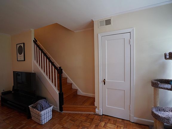 Roomy coat closet in living room.