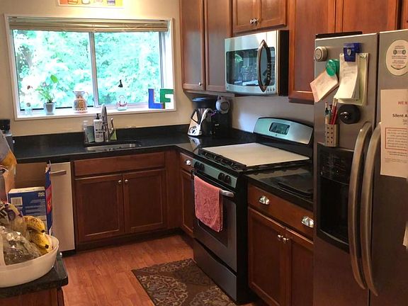 Bright kitchen with lots of cabinets and storage