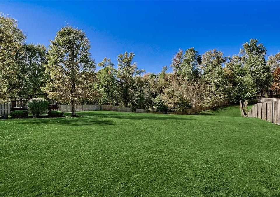 Nearly 1 Acre of Gorgeous Backyard Backing Up to the Woods...giving the feeling of space while still maintaining the feeling of comfort in a gated community...