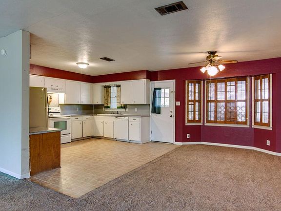 Nice large kitchen with window overlooking backyard and open to dining.