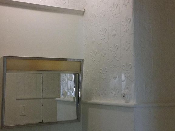Bathroom with cool tin details on walls and ceiling