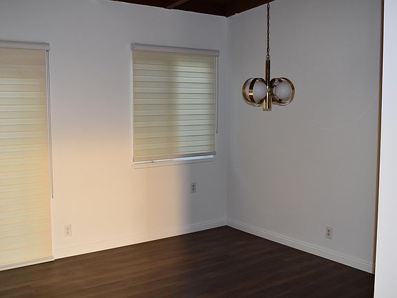 Formal dining area adjacent living room with immediate access to kitchen