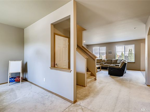 Enter to accented tiled flooring at the entrance and a formal living room to your left.
