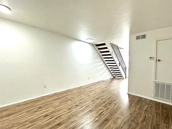 Living Room - All NEW flooring and lights.