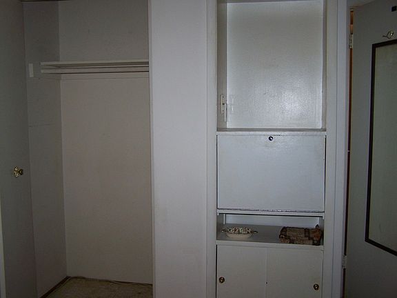 Master bedroom has two closets and built in entertainment cabinet