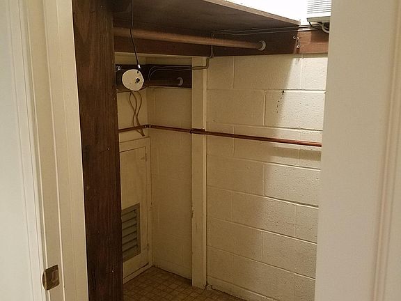 Walk-in closet (storage and clothes hanging)
