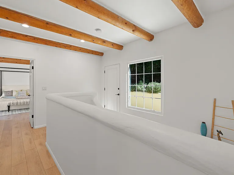 To upper yard and primary bedroom