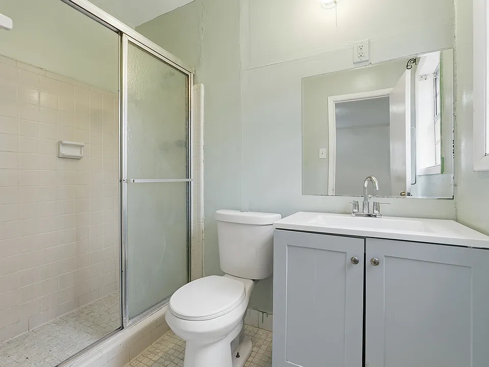 The lower level features a separate studio-style suite with its own full bathroom, kitchen, and private entrance ideal for a guest suite, home office, or bonus living space.