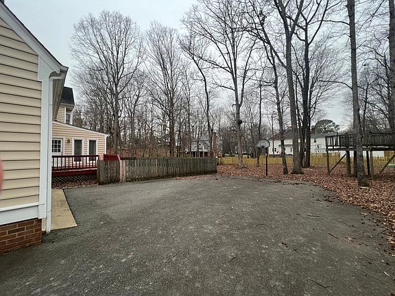 Photo of the backyard from the driveway