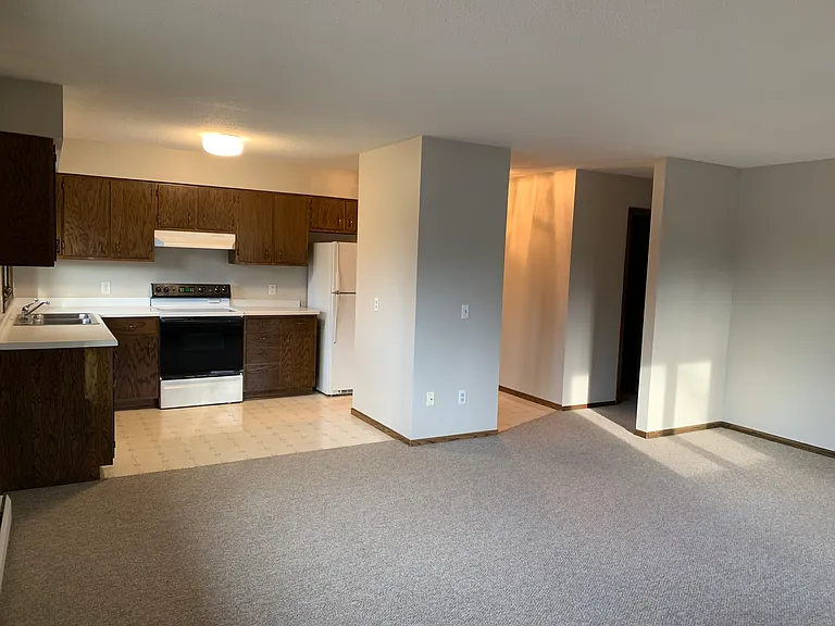 Kitchen, entry, hallway from SE perspective in living room
