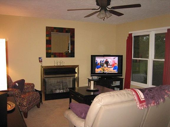 Simple yet stylish living room with gas logs that will keep you warm and cozy