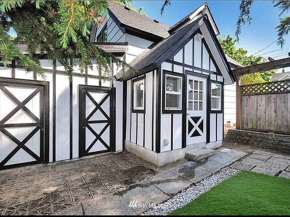 Partially fenced backyard with a well-maintained lawn. Perfect private outdoor space for relaxation.